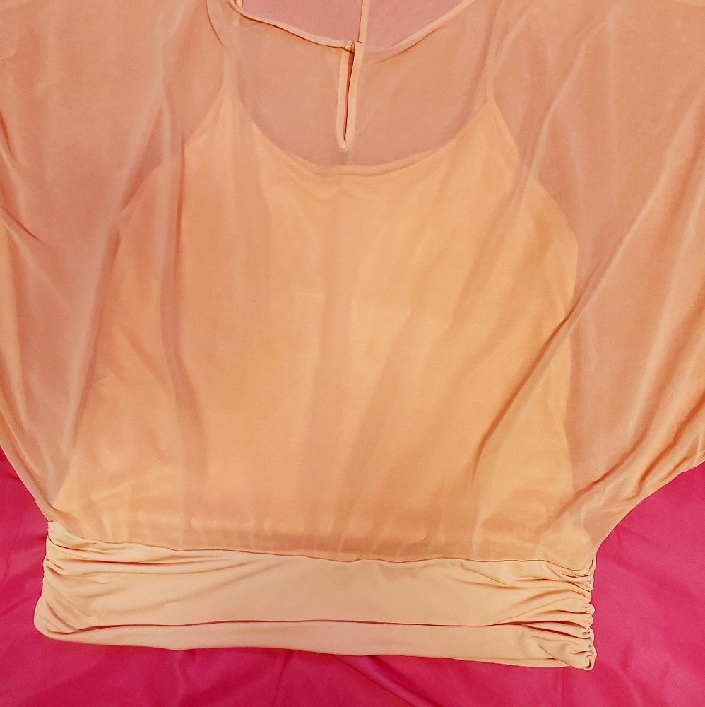 Jennifer Lopez sheer orange blouse